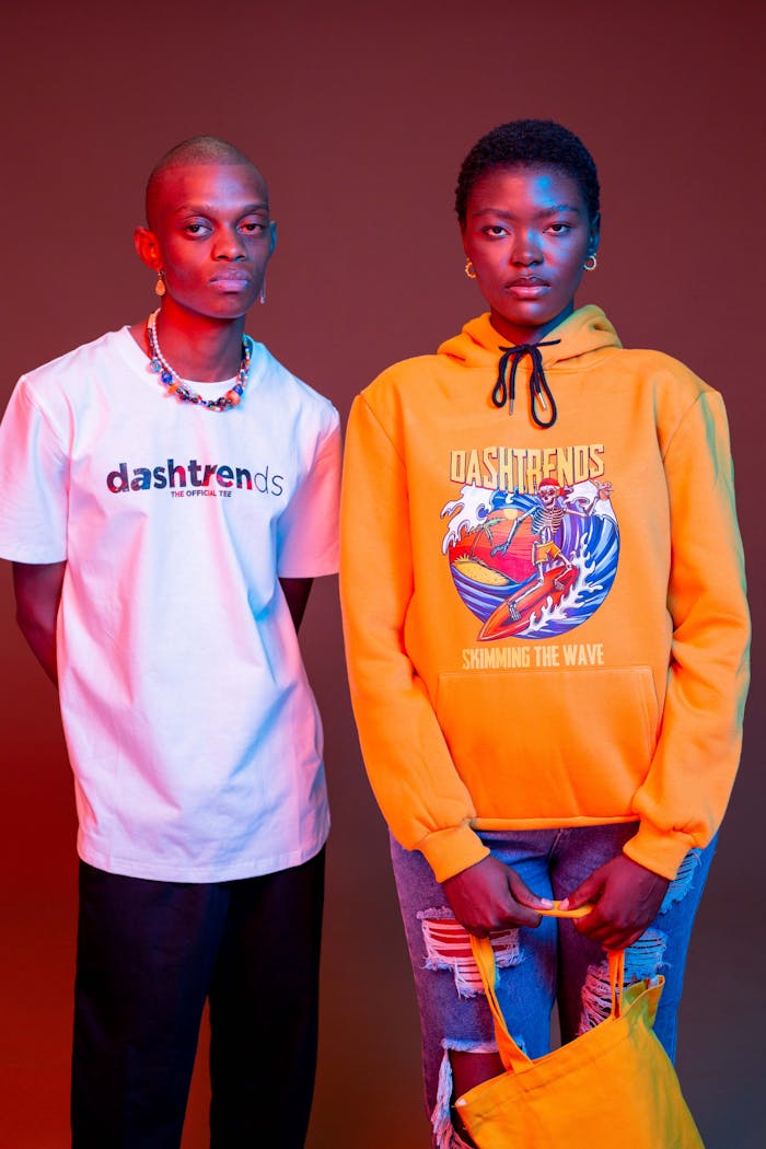 Home Fashion portrait of models in colorful outfits with dynamic red background, showcasing trendy streetwear.
